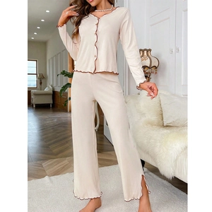 Two-piece ribbed knit pajama set with V-neck long sleeve top and wide-leg lettuce edge pants