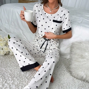 Detailed view of polka dot pajamas set with ribbed fabric and ribbon bow detail