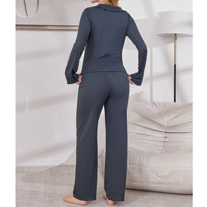 Women's dark gray ribbed pajama set featuring a ruffled collar and relaxed fit long pants