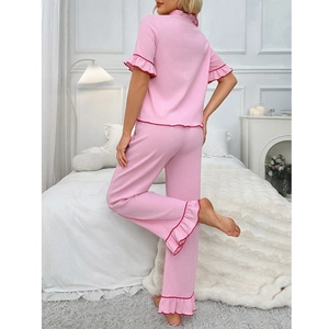 Pink short-sleeve pajama set for women with red ruffle edges and long pants