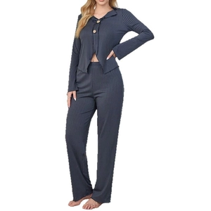 Dark grey ribbed knit pajama set featuring long sleeves and wide-leg trousers