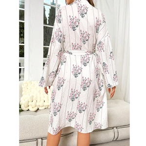 Back view of floral print V-neck sleepwear robe with tie-waist in a cozy living room setting