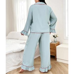 Relaxed light blue long-sleeve pajama set with red piping and ruffle details back view