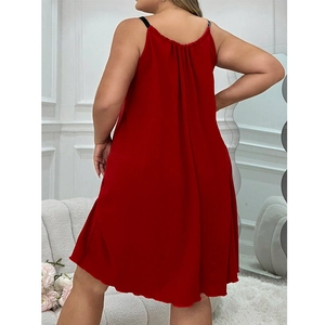 Loose red summer slip dress with thin black straps and textured fabric, back view detail