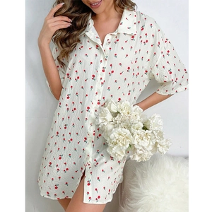 Detail of short sleeve cream nightdress with red floral print and button-up lapel collar