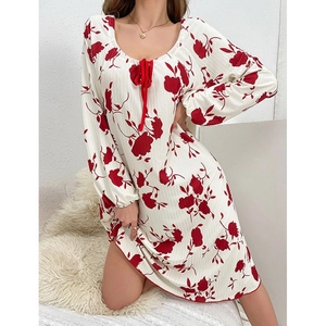 Detail view of U-neck with red bow on floral print long sleeve sleepwear dress