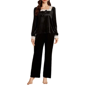 Elegant black velvet pajama set for women with white lace trim and bow tie detail