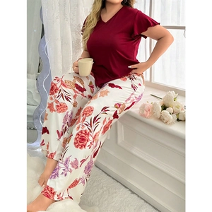 Detail of burgundy V-neck top with ruffle sleeves and floral print pajama wide-leg pants