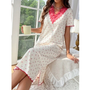Detail of sweet cherry print nightgown featuring red lace trim on V-neck and sleeves