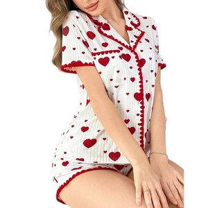 Women's heart print pajama set with short sleeves and matching shorts on white background