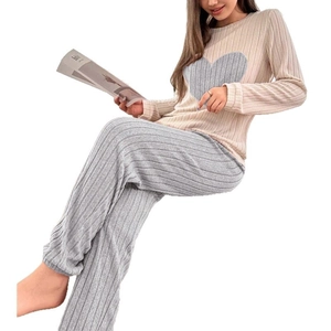 Women's two-piece ribbed pajama set featuring heart patch top and matching grey trousers