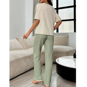 Women's two-piece loungewear set with short-sleeved top and trousers in textured fabric