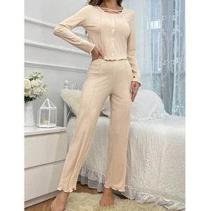 Women's minimalist beige long-sleeve pajama set with ruffle trim and rib-knit texture