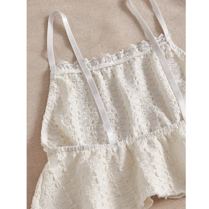 White textured camisole pajama set with delicate lace trim and ruffle hem for women