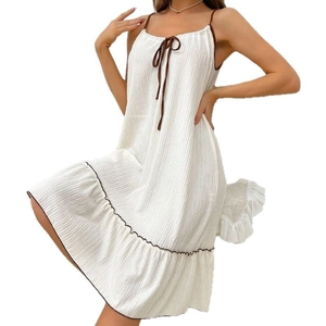 White sleeveless slip nightdress with pleated fabric and brown bow tie detail