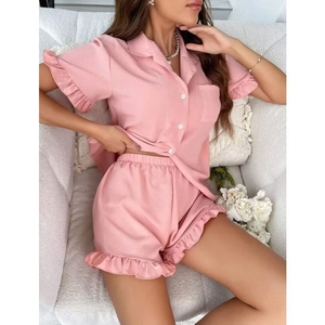Pink women's short sleeve pajamas set with ruffle hem and button-down collar