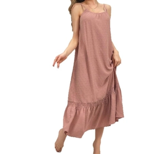 Elegant Swiss dot backless maxi dress in dusty rose with a ruffled fishtail hemline