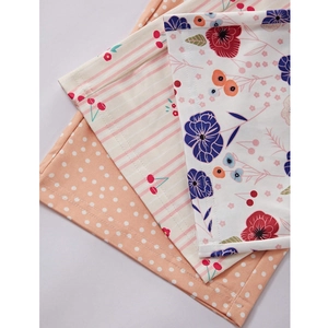 Three pairs of floral print pajama pants in cherry, polka dot, and flower patterns