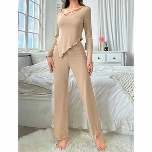 Detail of V-neck long sleeve loungewear set with ruffled hem in beige ribbed fabric