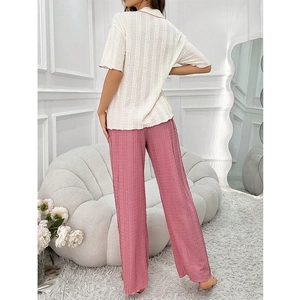 Women's V-neck short sleeve pajama set with pink contrast trim and pleated trousers