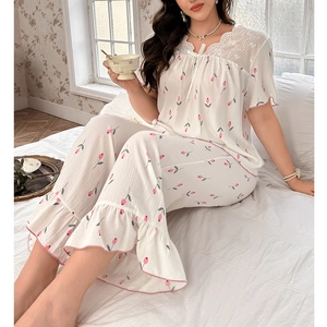 Women's pajama set featuring pink tulip prints, lace embroidery neck and ruffle hem