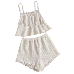 Women's cream lace camisole and shorts sleepwear set with ruffled hem details