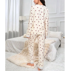Two-piece cream maternity pajama set with red heart prints and delicate lace trim
