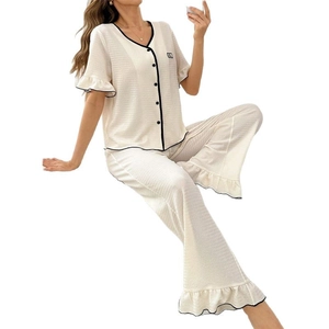 Women's cream short sleeve pajama set with black piping and high waist wide leg pants