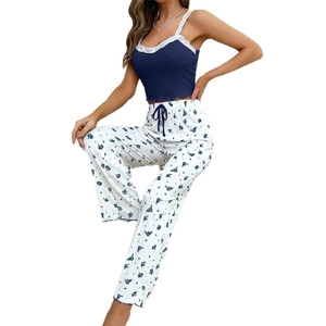 Women floral pajama set with navy lace camisole top and printed high-waist trousers