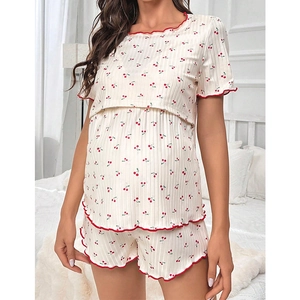 Detail of cherry print nursing pajama set with ruffled edges and nursing openings