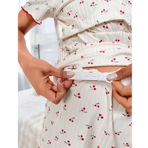 Detail of adjustable waist band with cherry print and ribbed texture on nursing pajamas