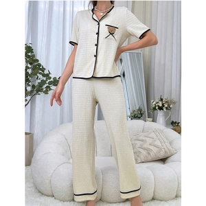 Women's V-neck pajama set in cream with cartoon bear patch and textured fabric finish