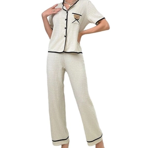 Women's V-neck waffle knit pajama set in cream white with cute bear embroidery and piping