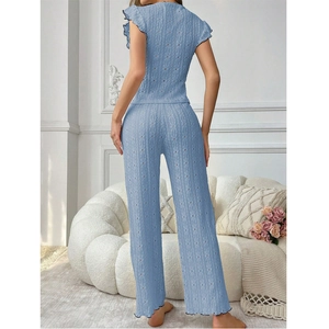 Elegant light blue women's pajama set with lace details and black ruffle trim decorations