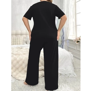 Women's minimalist black two-piece loungewear set with round neck short sleeve and wide pants