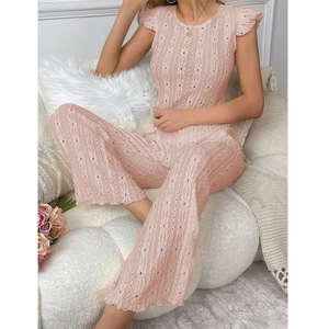 Women's pink eyelet knit two-piece set featuring sleeveless top and wide-leg trousers