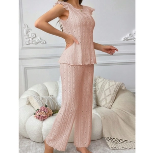 Pink two-piece loungewear set with ruffled sleeveless top and wide-leg knit trousers