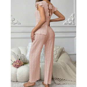 Pink backless knit pajama set for women featuring hollow out patterns and wide leg pants