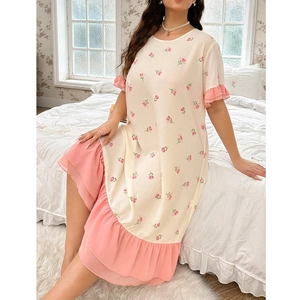 Detail of floral sleepwear dress with pink chiffon ruffles and textured beige fabric