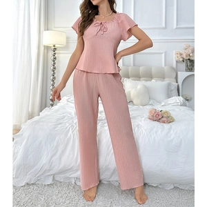 Pink textured short-sleeve pajama set with ruffle trim and lace-up neck for women