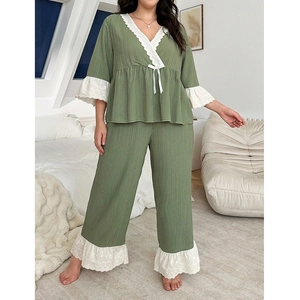 Olive green plus size women's pajama set with V-neck lace trim and wide-leg trousers
