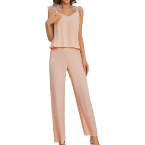 Pink V-neck camisole pajama set with lace shoulder straps and matching long pants