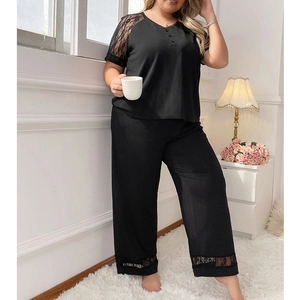 Black lace plus size sleepwear set with short sleeves and loose trousers in home setting