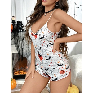 Detail of white Halloween romper with pumpkin and ghost prints on cozy jersey fabric