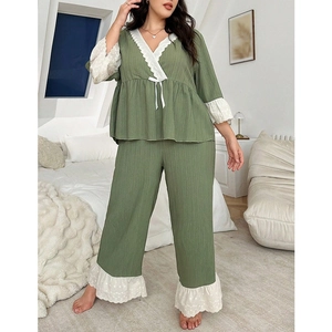 Avocado green two-piece pajama set with V-neck lace trim and wide-leg trousers