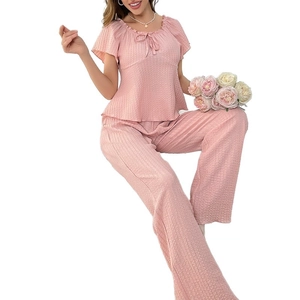 Pink textured short sleeve loungewear set with ruffle sleeves and tie-neck details