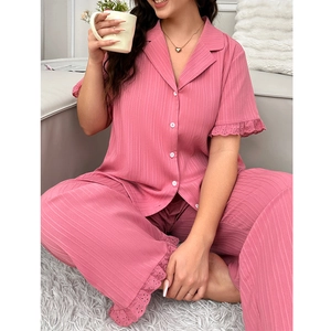 Detail of pink plus size pajama set with vertical stripes and hollow lace trim cuffs