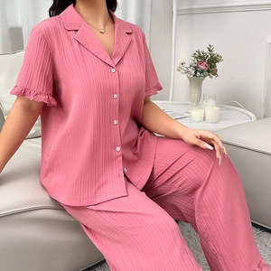 Detail of plus size pajama set with lace hollowed short sleeves and vertical texture fabric