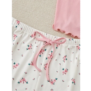 Women floral lounge set featuring pink ribbed camisole and matching frill shorts