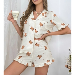 Close-up of ruffled hem shorts and cute bear print pattern on breathable pajamas